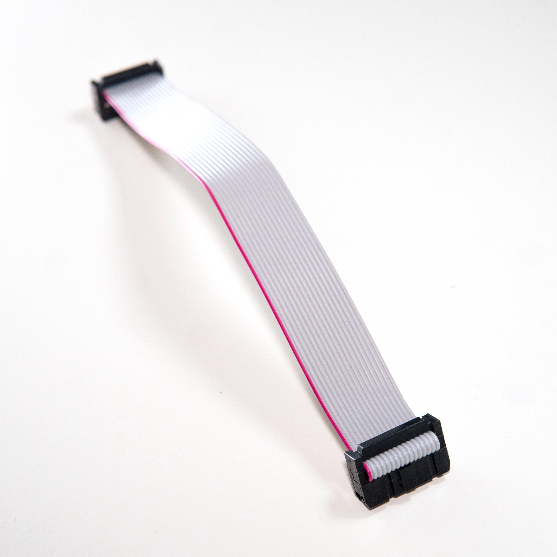 A 16-pin to 16-pin ribbon cable with IDC connectors for connecting Eurorack modules to a power bus board.