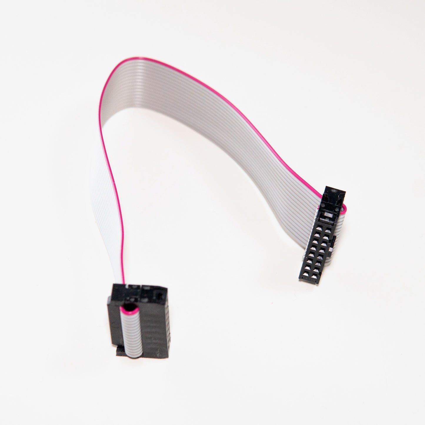 A 16-pin to 16-pin ribbon cable with IDC connectors for connecting Eurorack modules to a power bus board.