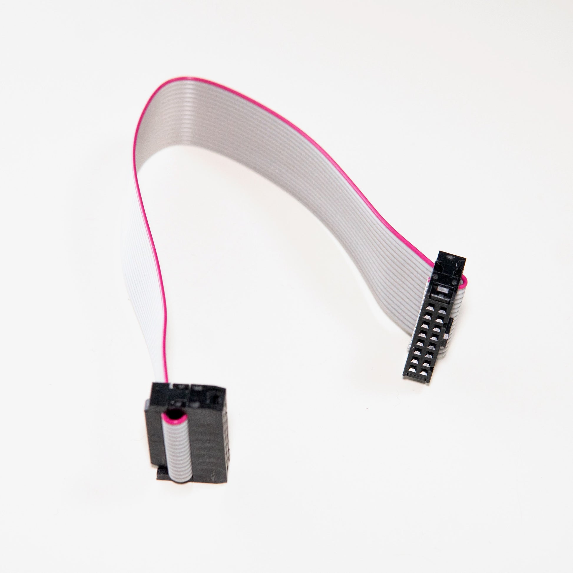 A 16-pin to 16-pin ribbon cable with IDC connectors for connecting Eurorack modules to a power bus board.