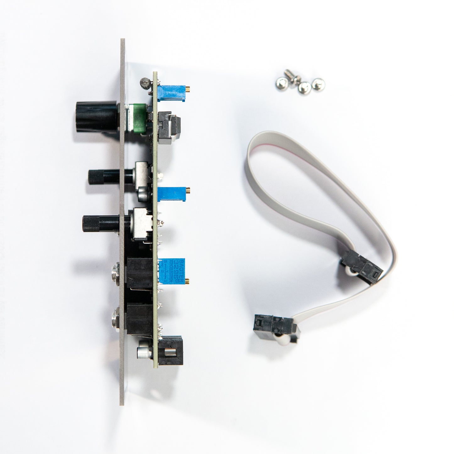 3340 VCO eurorack synth module side view. showing the depth of the mudule. Suitable for skiff racks. ribbon power cable and mounting screws visible on the side.