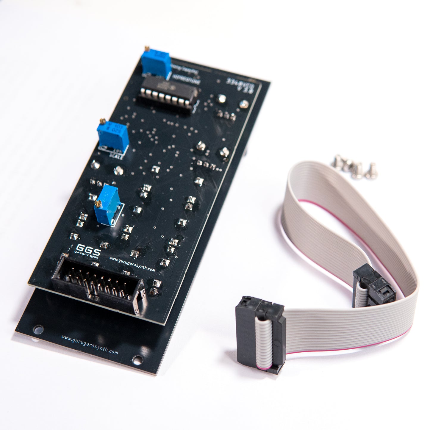 3340 VCO Eurorack module rear view. Eurorack power connector, calibration trimmers and AS3340 IC visible. Ribbon power cable and mounting screws visible on the side. 