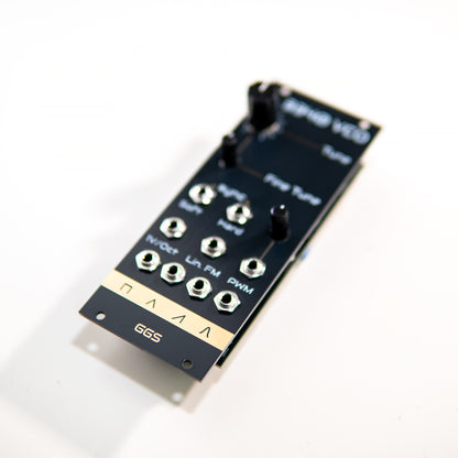 3340 VCO analog eurorack synth module. Angled photo. GGS logo in focus. PCB art front panel.