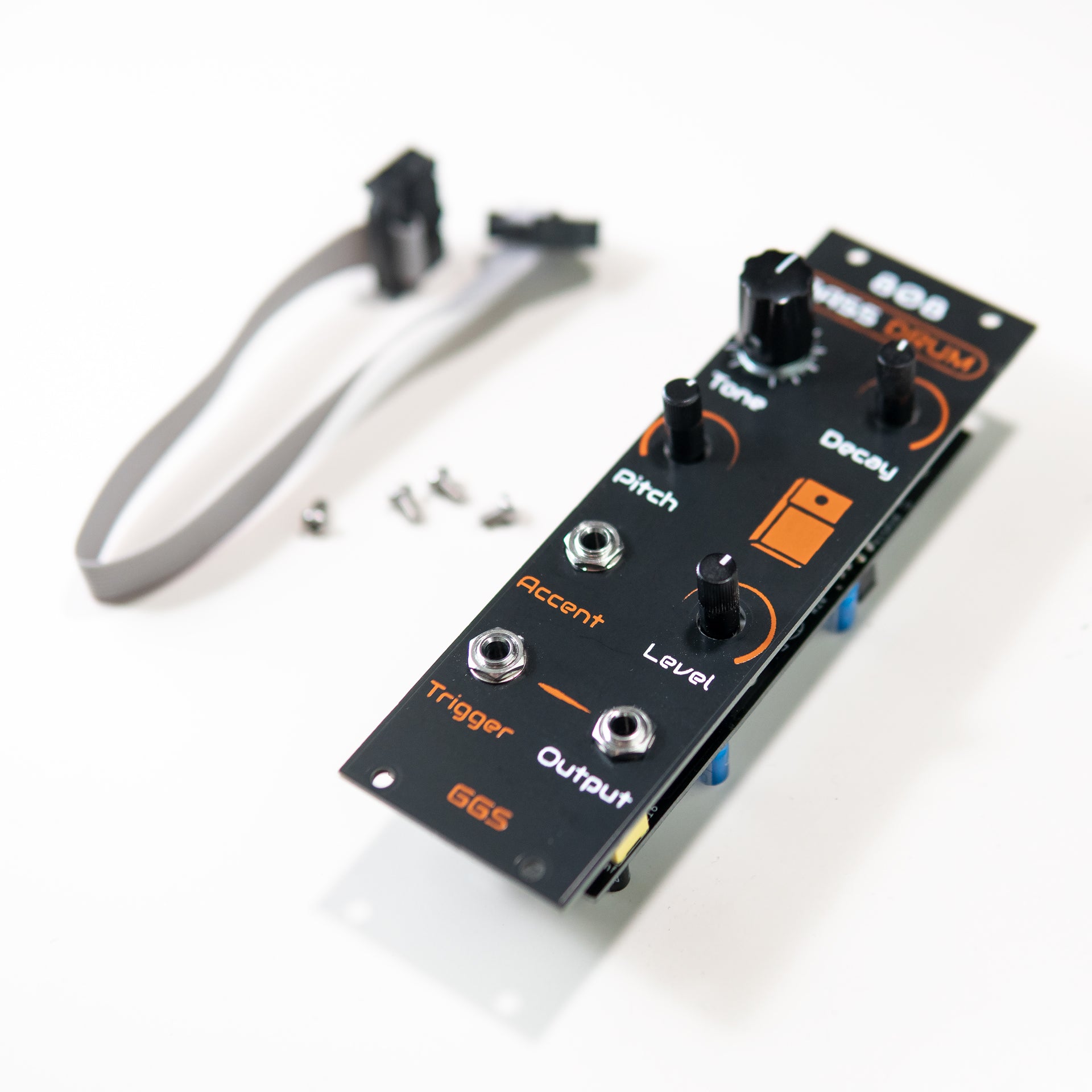 A perspective photo showing screen-printed PCB front panel of the 808 Bass Drum Eurorack module. The text and lines are slightly raised, showing the texture of the hand-made silk-screen.