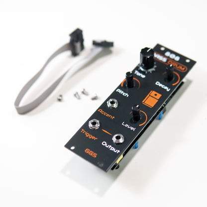 A perspective photo showing screen-printed PCB front panel of the 808 Bass Drum Eurorack module. The text and lines are slightly raised, showing the texture of the hand-made silk-screen.