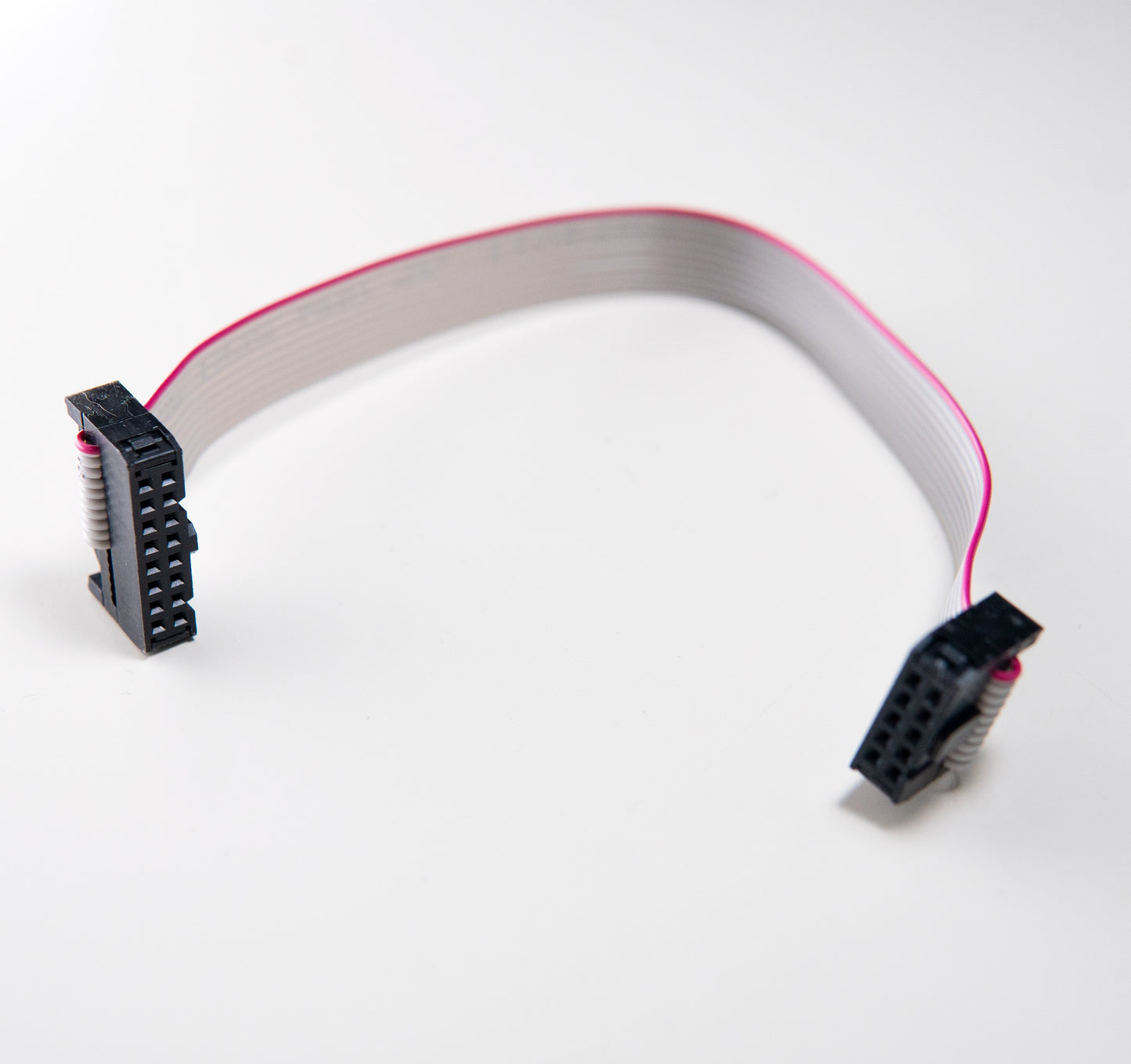 A 10-pin to 16-pin ribbon cable with IDC connectors for connecting Eurorack modules to a power bus board.