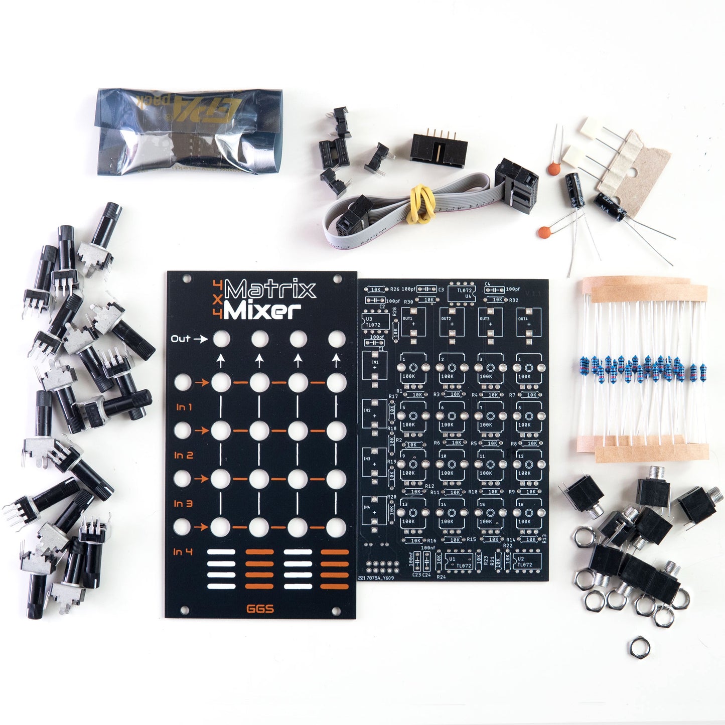 Matrix Mixer full DIY Kit. PCB and fron t panel inth e middle of all the components needed to build the eurorack module.