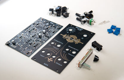 Riot ST VCF - Stereo Low Pass Filter for Eurorack modular synth. Full DIY kit. PCB, front panel and components visible. SMD and THT components such as jack sockets, potentiometers and filter. Photo with an angle.