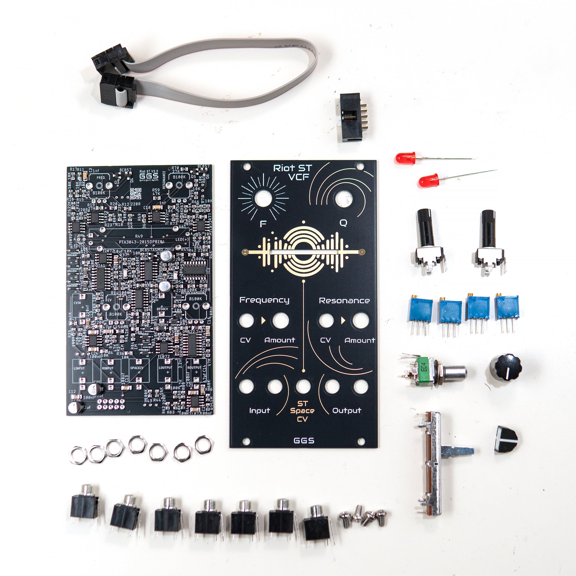 Riot ST VCF Full DIY Kit. Factory assembled SMD PCB and Front Panel surrounded  by all the THT components needed for this eurorack stereo filter module.