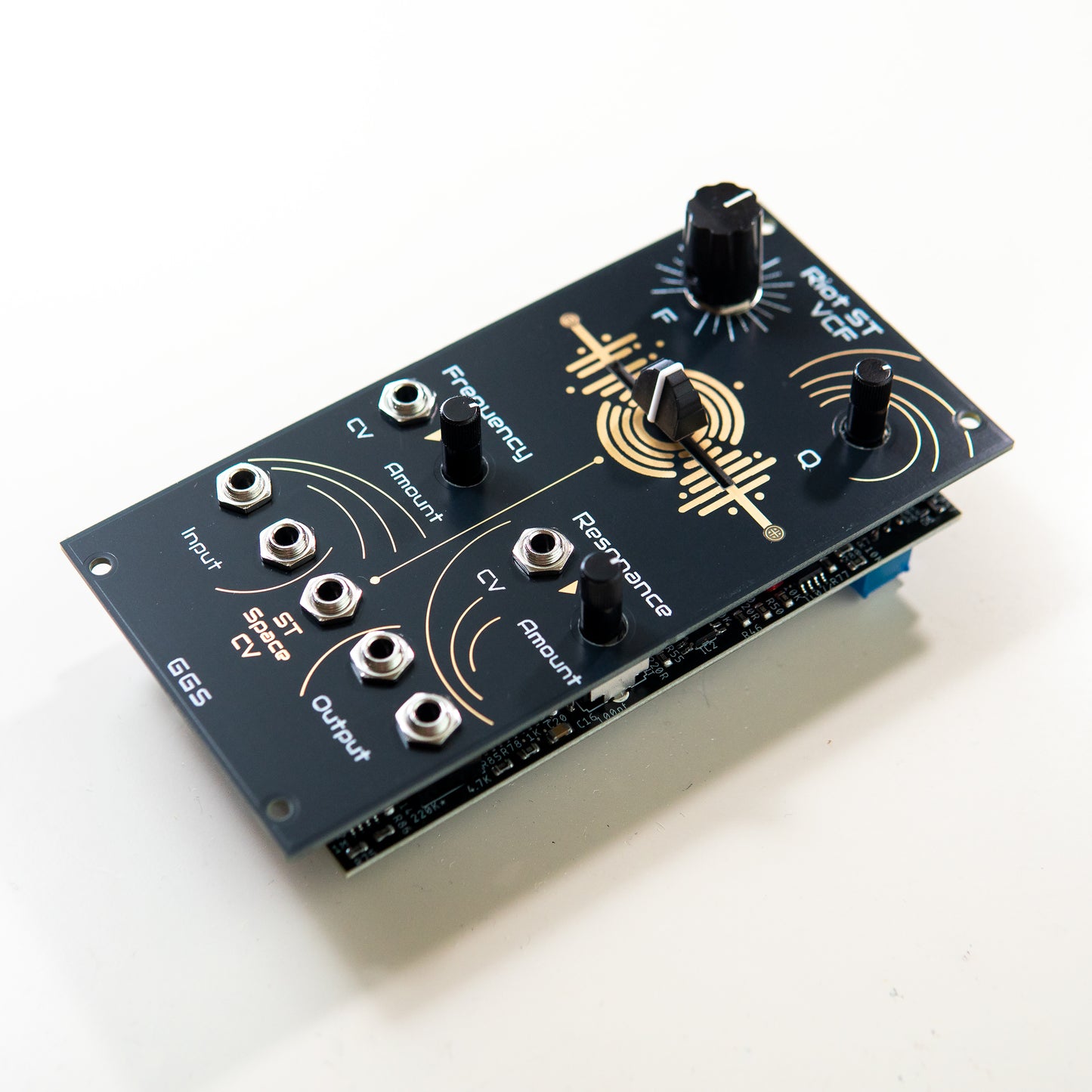A detailed close-up of the Riot ST VCF's "Stereo Space" fader, showing the slider control for manipulating stereo cutoff frequencies. The unique black and copper PCB traces are visible around the control.